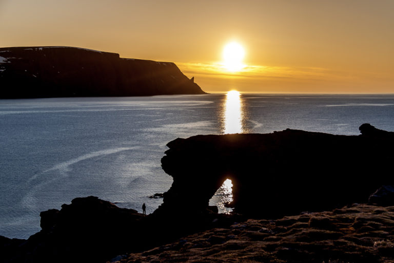 Midnight Sun at the "Church gate" - Kirkeporten. The North Cape is in the background © Kjell Bendik Pedersen