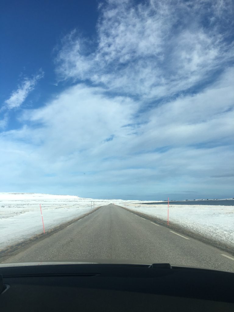 Very soon you are driving into a lunar landscape with sea on one side and endless rocky fields on the other punctuated by communities along the route © William Copeland