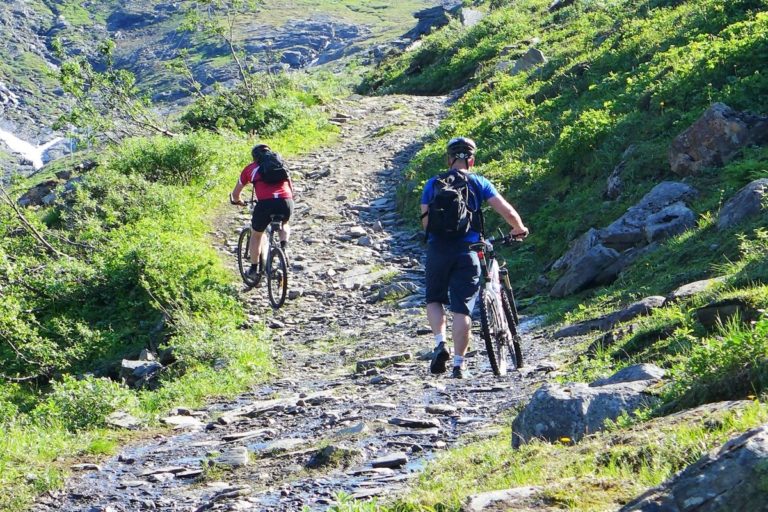 There's no shame in some of the tougher uphill sections to get off your bike and walk with it © Georg Sichelschmidt - Visit Lyngenfjord