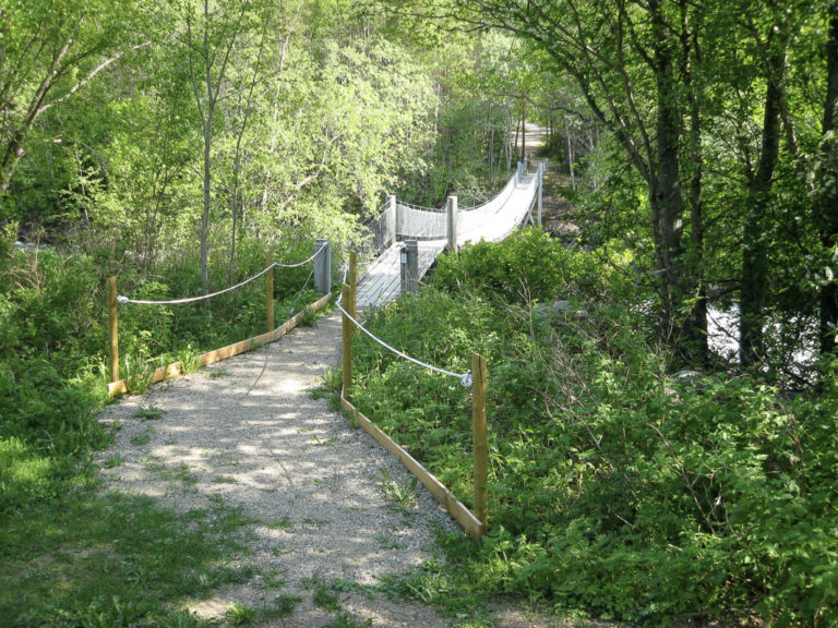 A bridge crossing a babbling brook © Storjord Hotel