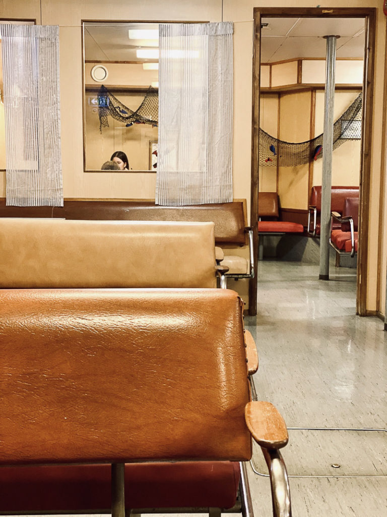 Solid benches and worn linoleum, an old fashioned ferry cafe under the car deck © Kathrine Sørgård