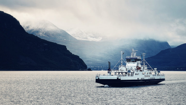 Crossing the Ullsfjord with fresh snow (late August) in the Lyngen Alps © Petr Pavlek/Visit Lyngenfjord