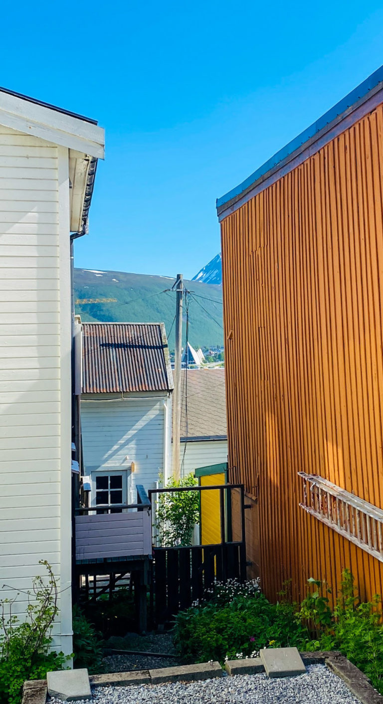 Glance between old wooden houses towards the Arctic Cathedral © Knut Hansvold