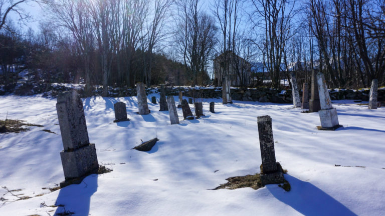 The cemetary at Bjarkøy Island is full of old graves that nobody looks after anymore. Frost in the ground makes the gravestones move and eventually tip over. Then one has conciously left them there. That gives the cemetary a melancholy beauty © Knut Hansvold