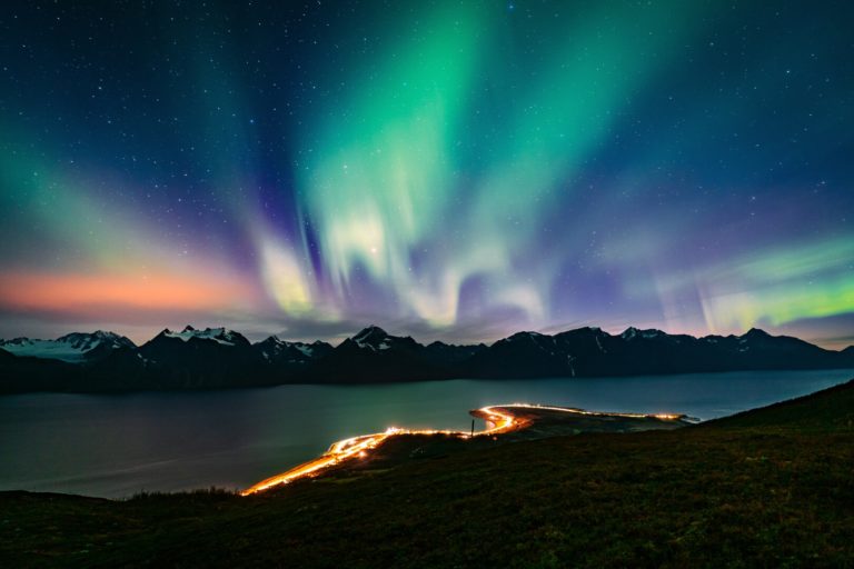 Northern Lights over the Lyngen Alps, seen from the mountains behind Spåkenes point in Kåfjord © Petr Pavlíček/Visit Lyngenfjord