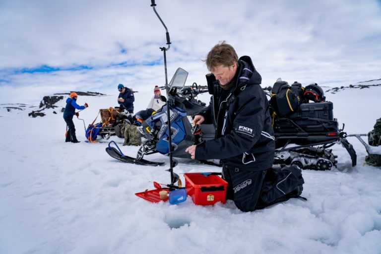 Snowmobiling can be combined with ice fishing © Petr Pavlíček / Visit Lyngenfjord
