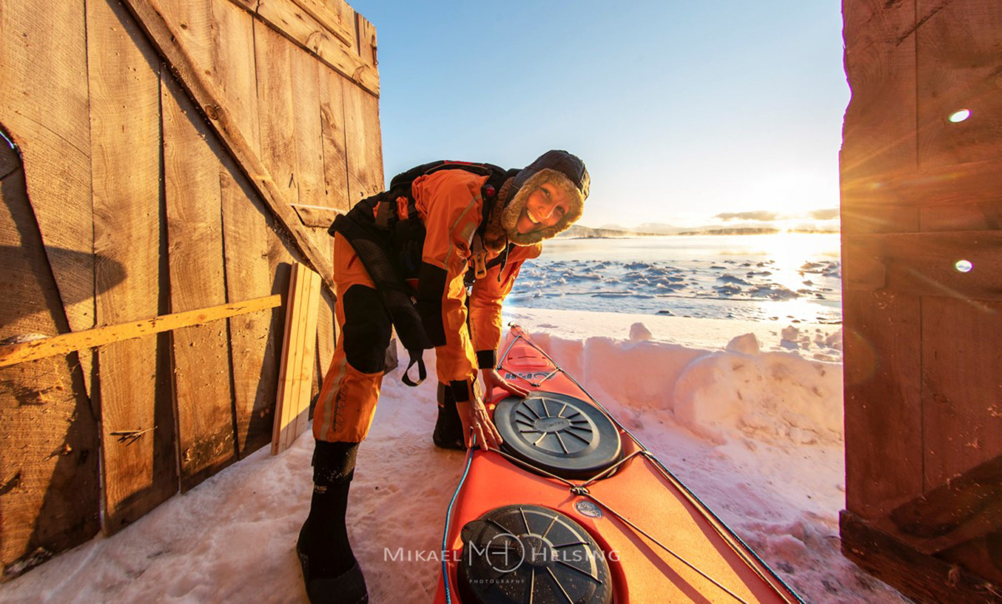 Pull the kayak into the snow and onto the icy fjord, and then go kayaking in Tranøybotn in the middle of winter © Norwegian Wild