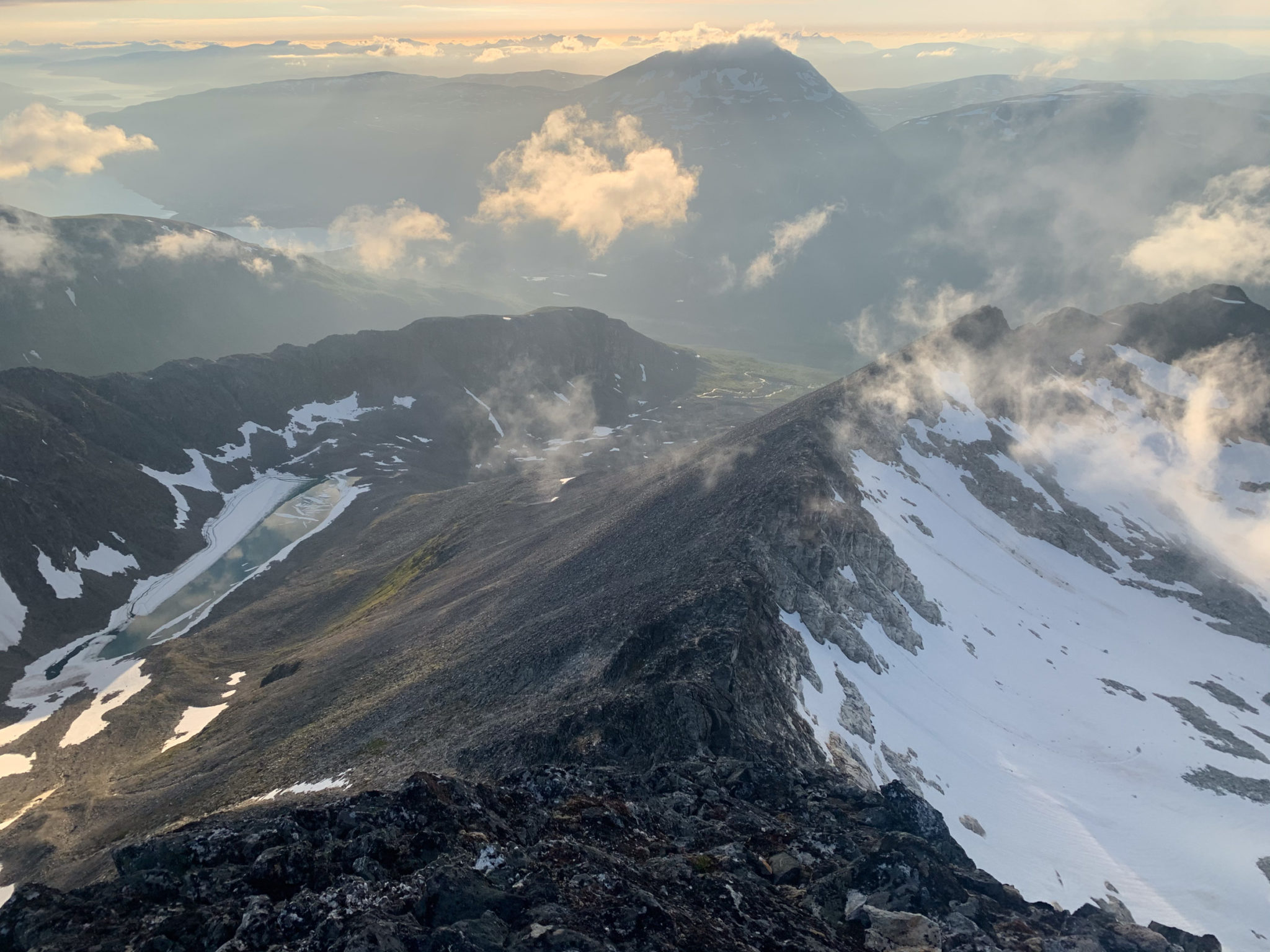 View from the top of Hamperokken overlooking the sharp ridge. Beyond the valley, Mount Tromsdalstind looms in the distance, hiding the city of Tromsø © Kristin Harila